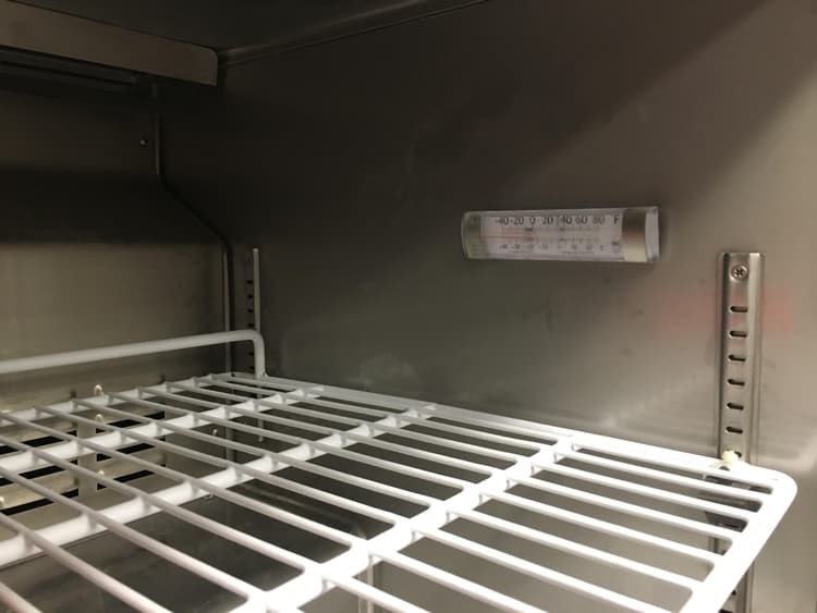Position of thermostat within the freezer compartment. Also, showing the nice stainless inside wall panels.